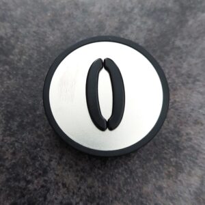 KM801054G000 Szyld podstawy przycisku "0" dyspozycji KONE