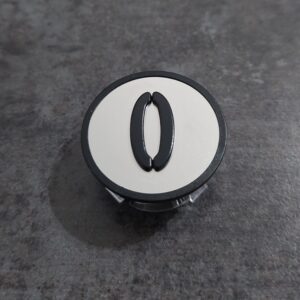 KM801055G000 Szyld "0" do podstawy przycisku wyższej KONE