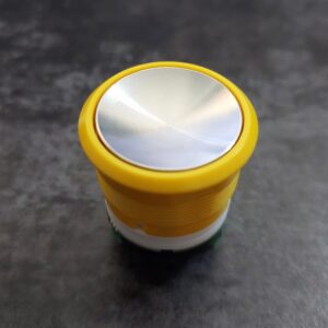 FAA25090AH102 Przycisk ALARM matowy żółte podświetlenie OTIS